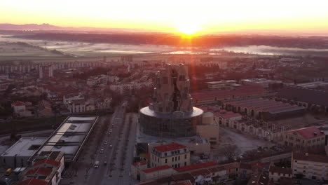Mystic-foggy-aerial-shot-of-Arles-modern-building-Luma-foundation-sunrise